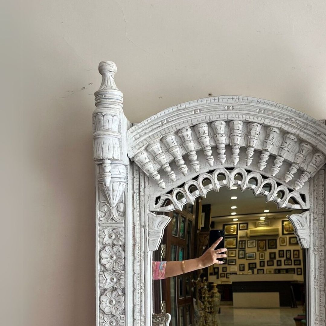 Large vintage mirror featuring a handcrafted Jharokha frame with intricate wood carvings, ideal for Victorian-style living rooms or antique wall displays.