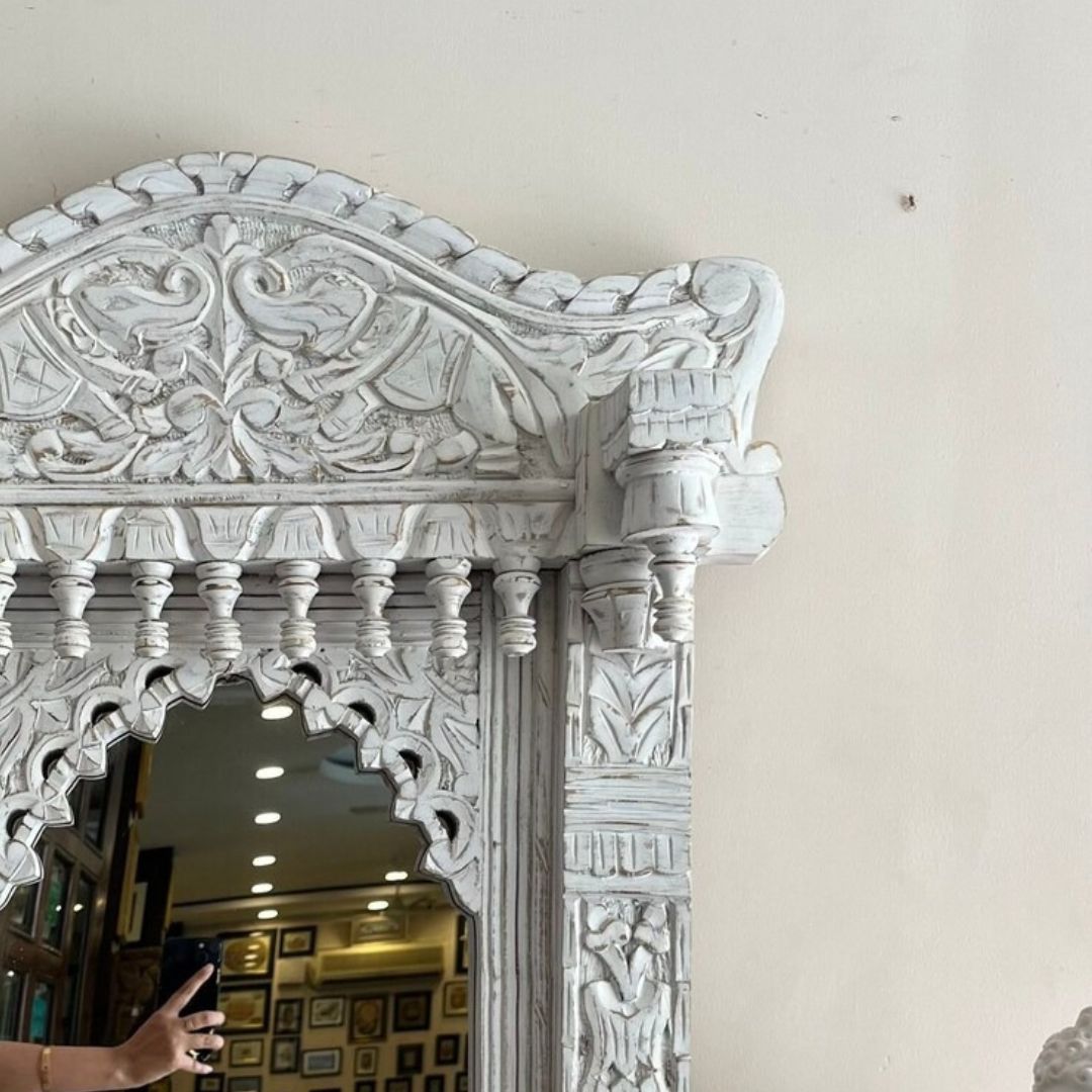 A beautifully carved large vintage mirror in a jharokha mirror frame, featuring intricate traditional Indian designs, perfect as a statement piece for wall decor or a dressing table."