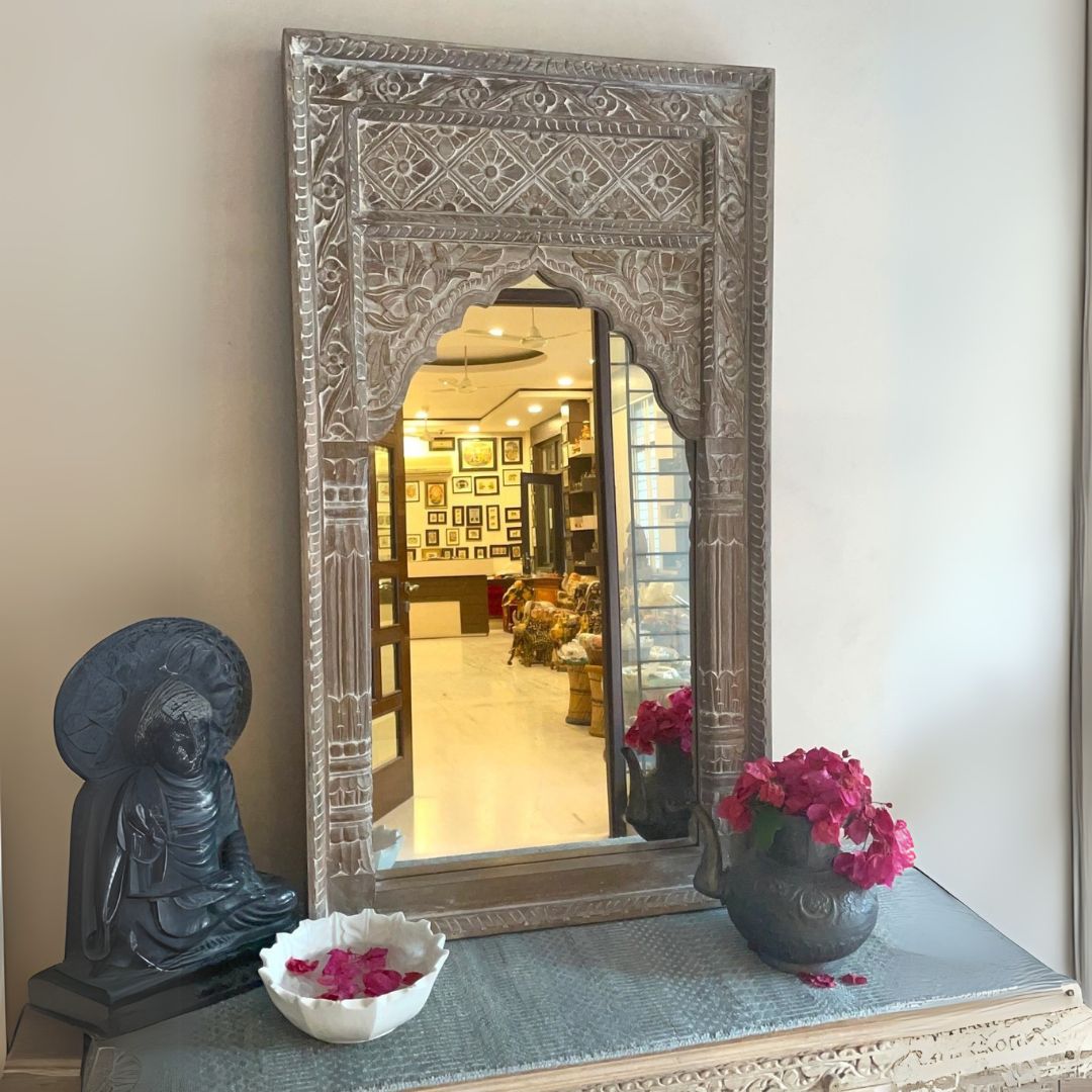 "A stunning antique gold-framed bathroom mirror crafted with a jharokha-inspired frame, blending rustic charm and vintage aesthetics
