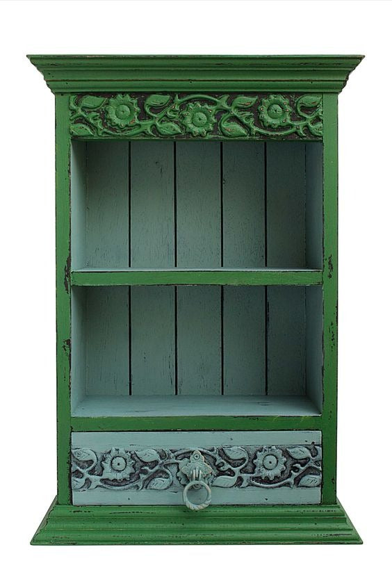 Antique-inspired wall shelf with drawer and storage space, perfect for pooja mandirs or decorative arrangements. Designed with brass accents and solid wood craftsmanship, this shelf enhances wall decor while providing practical storage for small items and sacred essentials.