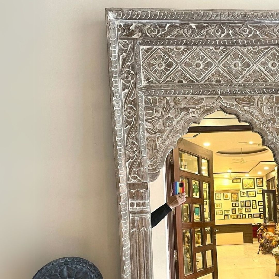 Large wooden mirror in a jharokha mirror style, perfect for adding a touch of antique brass mirror detailing to your living space