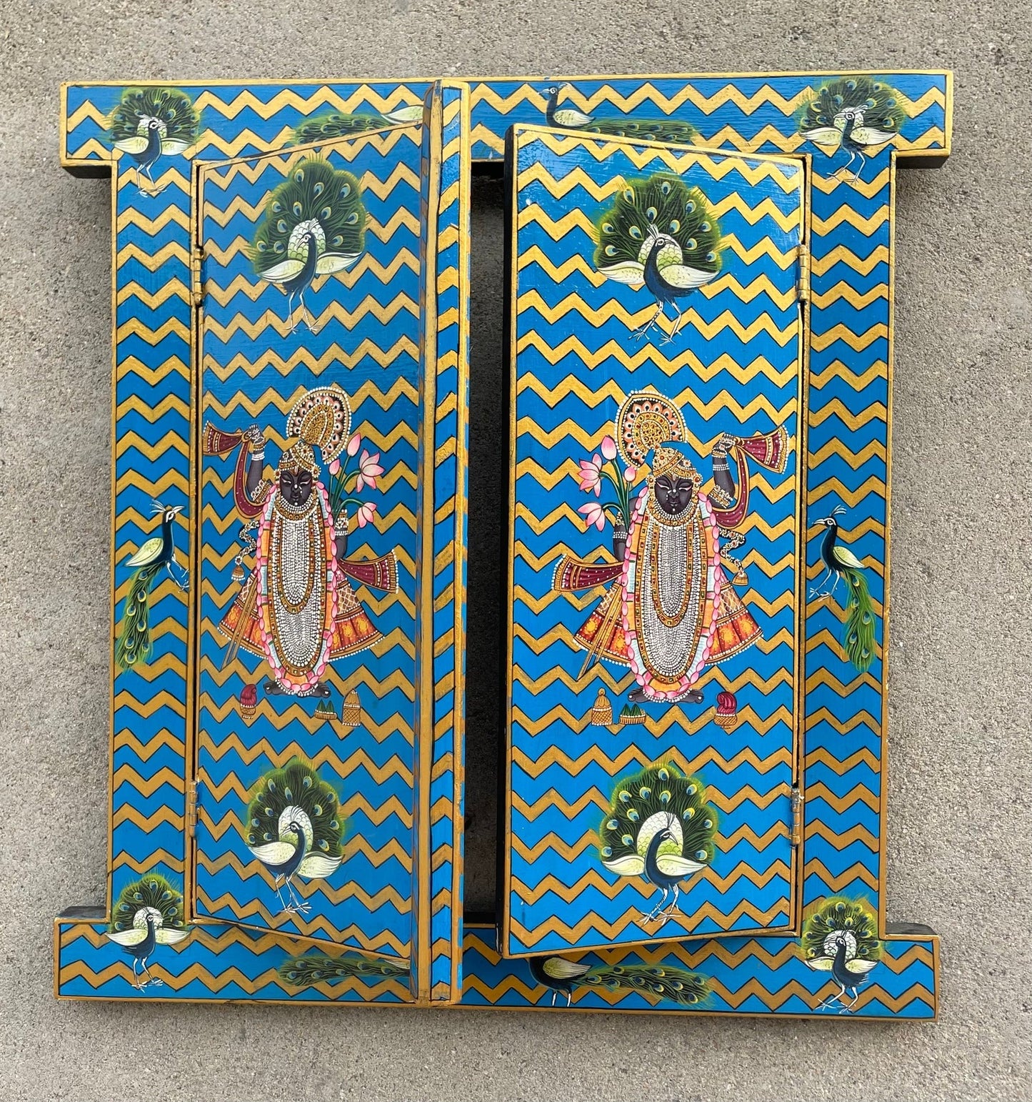 Hand-painted wooden temple door panel in red and gold chevron design with traditional Indian devotional artwork, solid wood mandir decor 16x18 inches Traditional hand-painted wooden mandir door panel with red background and golden chevrons, Indian temple decor solid wood Handcrafted wooden temple doors panel featuring Indian devotional art, red and gold chevron pattern, home mandir decor Indian hand-painted wooden pooja mandir door panel with traditional motifs, red and gold solid wood wall decor Decorative