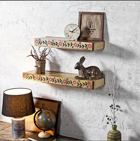 Elegant wall decor set of 2 painted wooden shelves with a vintage touch, perfect for adding functionality and charm to your living space. These carved wooden wall shelves work well for displaying collectibles, storing essentials, or as a stylish wishing chair accent in your decor