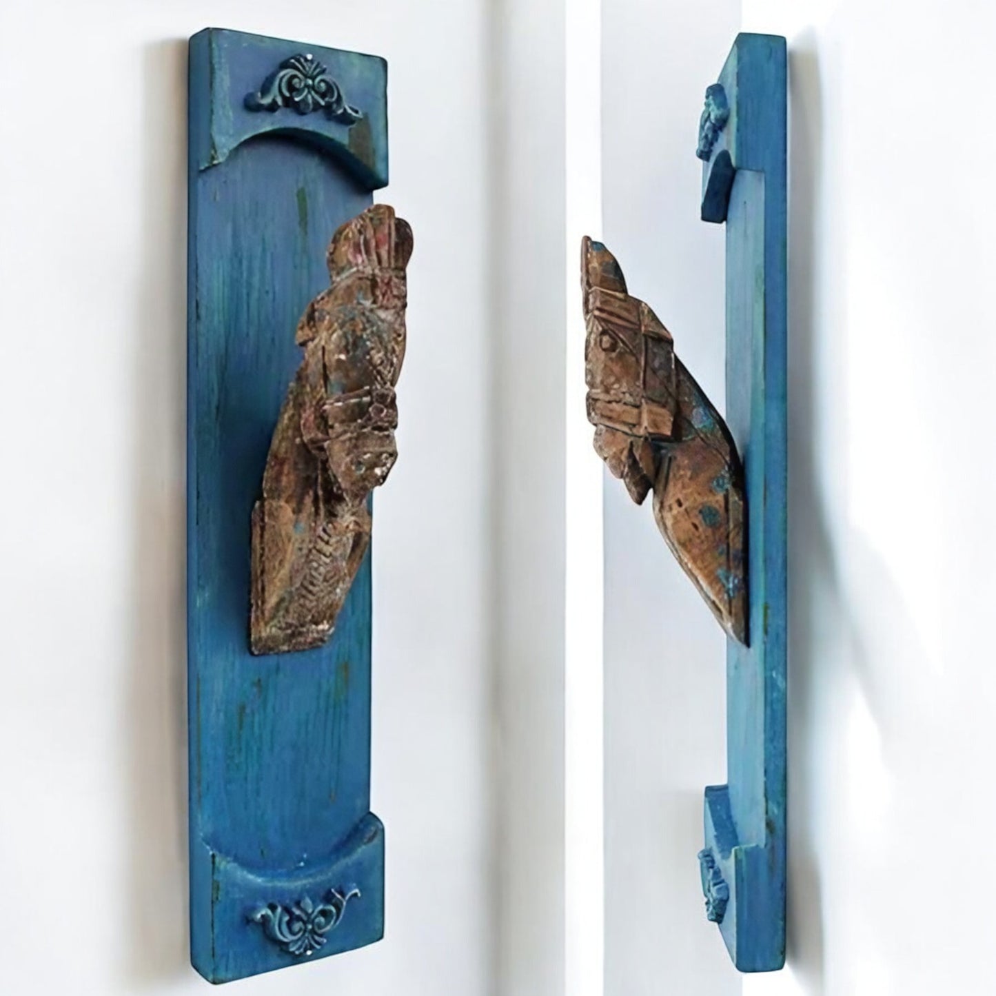 Rustic hand-carved blue wooden wall decor panels with intricate antique designs, perfect for adding vintage charm to your home.