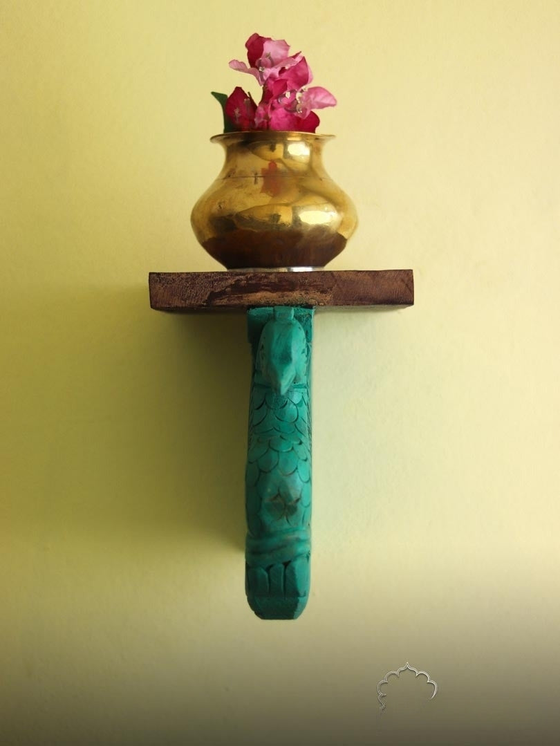 Elegant wooden wall bookshelf with a carved peacock-inspired design, doubling as a stunning wall decor piece. Ideal for storing books, displaying decorative items, or adding charm to living rooms, bedrooms, and entryways