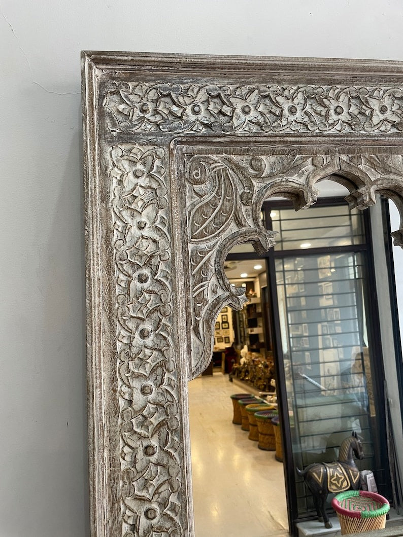 "Rustic Jharokha mirror with a large wooden frame and carved details, an eye-catching addition to retro wall art or Victorian-style interiors."