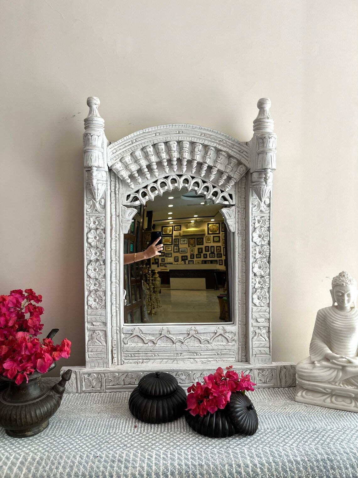 White vintage Jharokha mirror with bold hand-carved details, combining antique aesthetics with modern elegance for unique wall decor