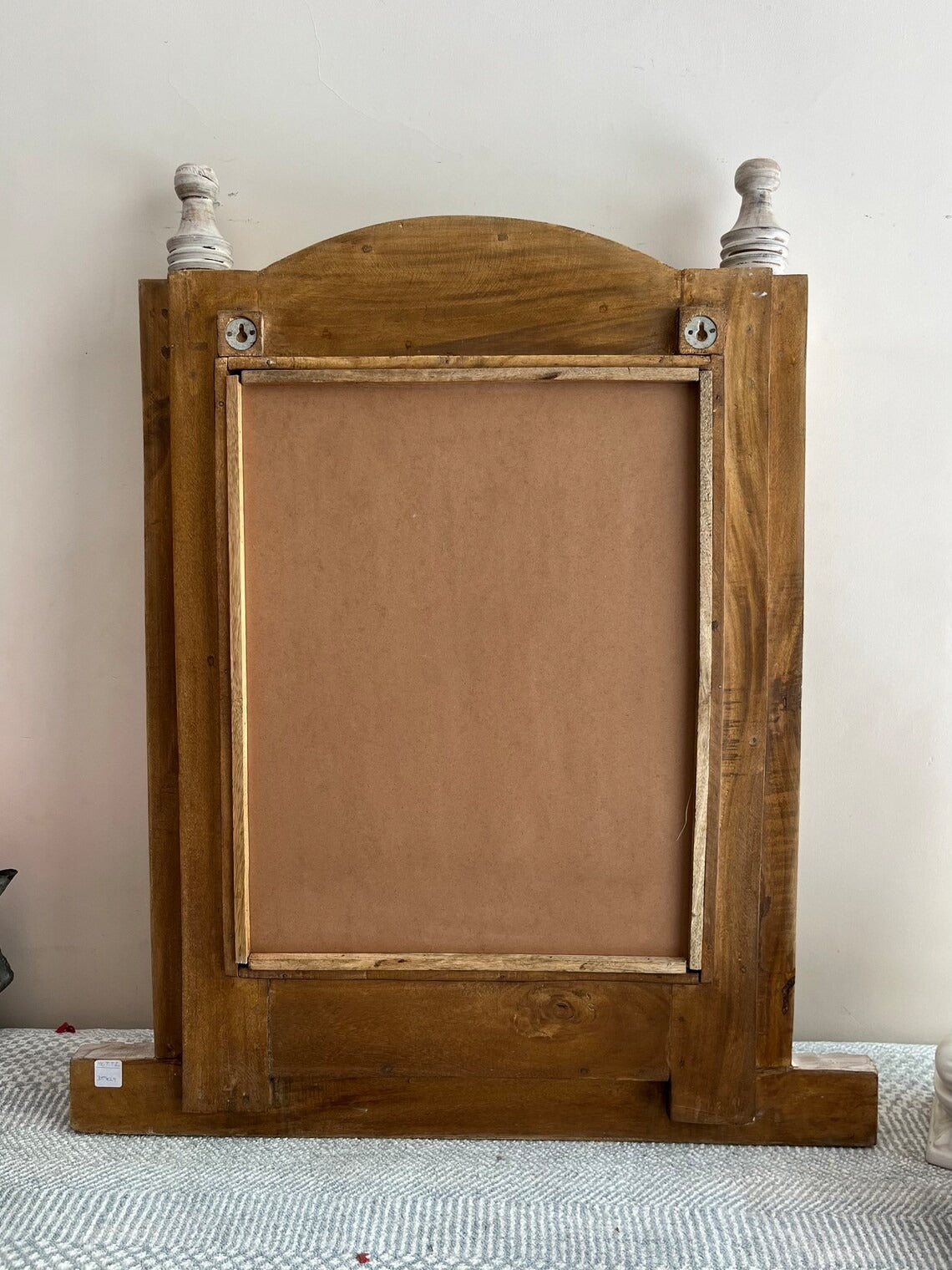 Handcrafted Jharokha mirror frame in distressed wood, adding a rustic charm to antique wall decor or large vintage full-length mirrors."