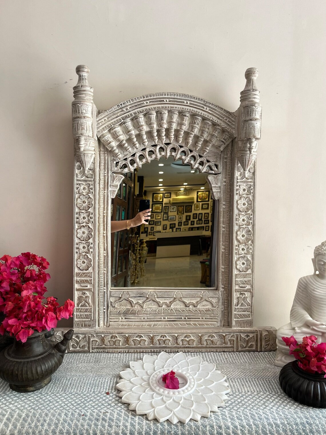 Big vintage mirror framed with a beautifully carved Jharokha-style design, blending traditional Indian architecture with contemporary home decor