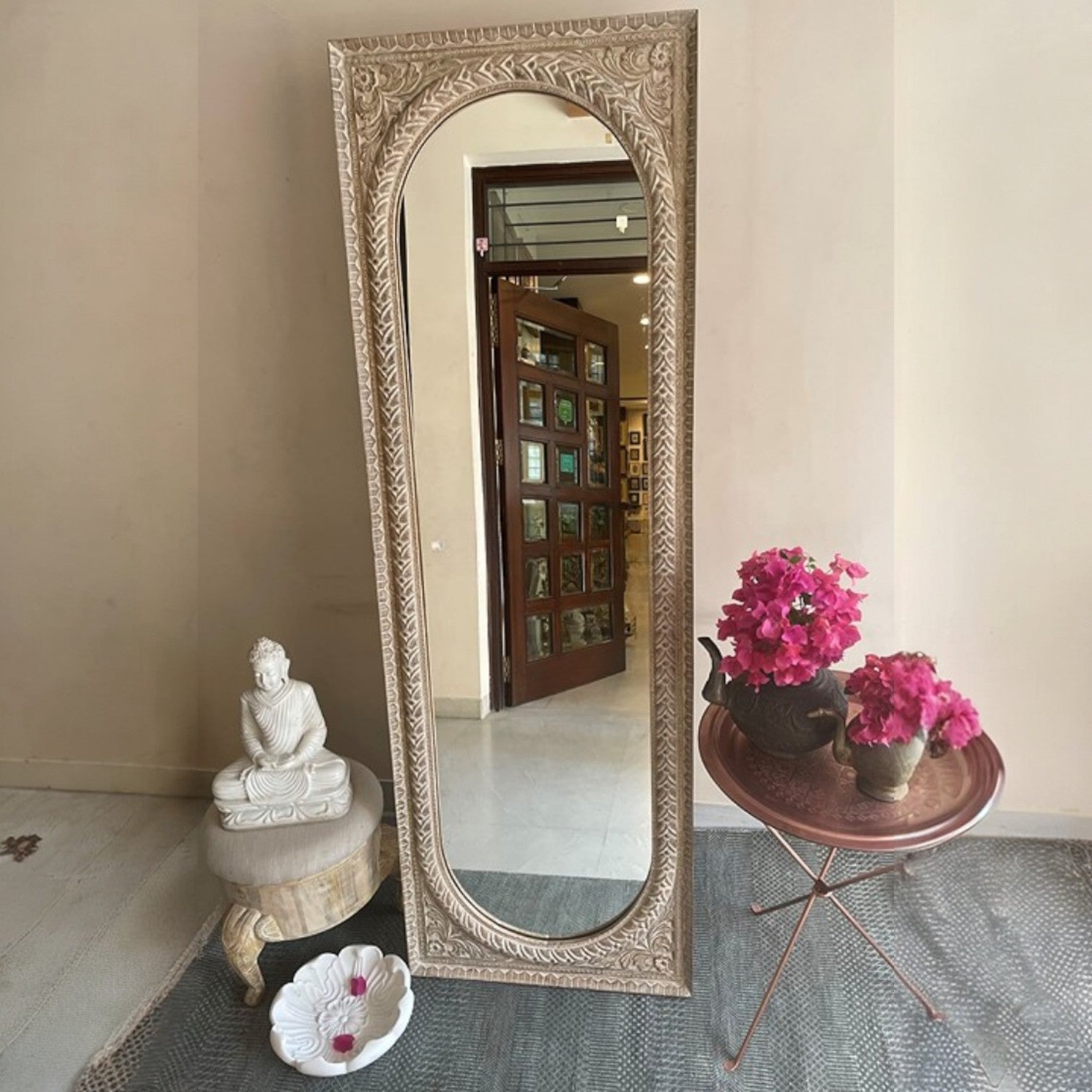 Elegant jharokha mirror featuring a large vintage mirror framed with intricately carved wood and brass accents, perfect for creating a rustic, antique look in your home. Its unique design makes it ideal for vintage floor mirrors, or as a striking addition to vintage wall decor, giving any space a timeless appeal.