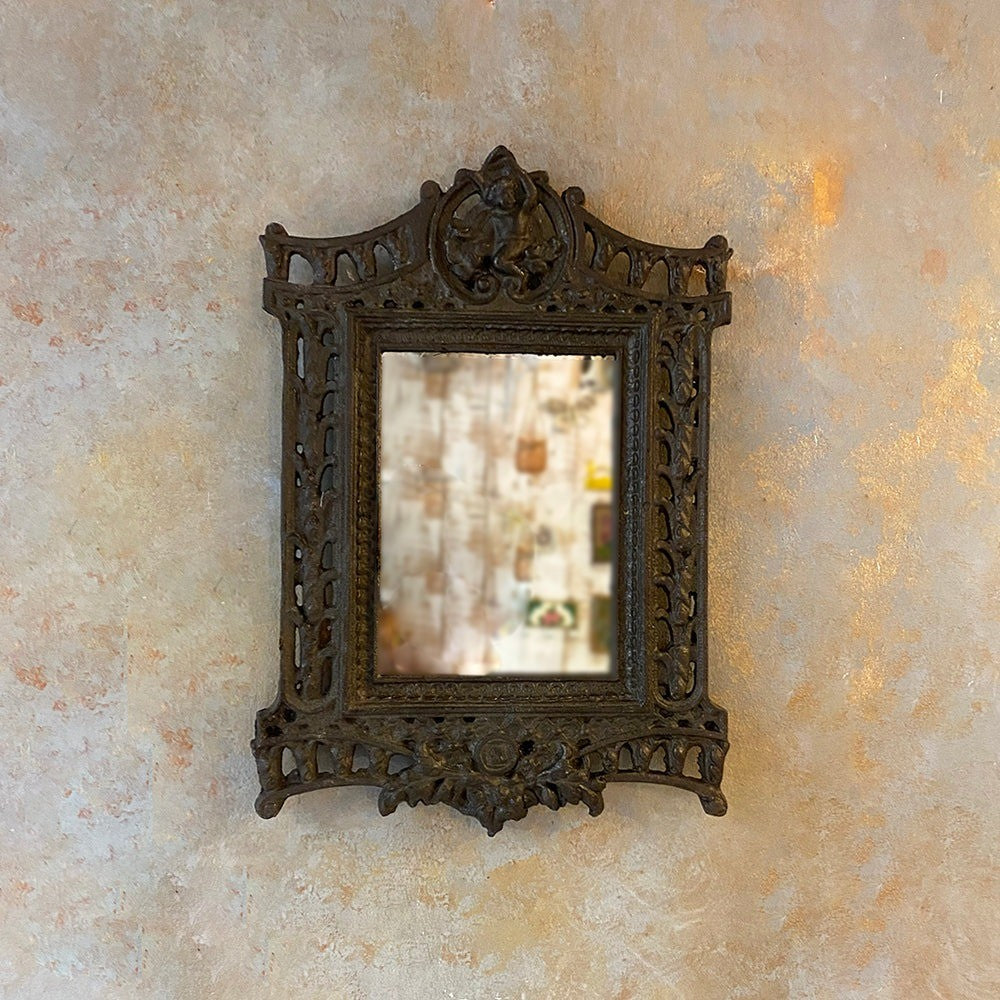 Handcrafted carved wood mirror with antique brass frame, ideal for wall decor