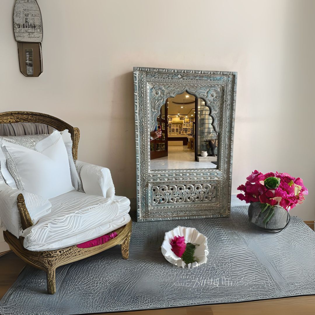 "Stunning Jharokha mirror with antique brass accents and bold carved designs, perfect for enhancing entryways or complementing a vintage bathroom decor setup