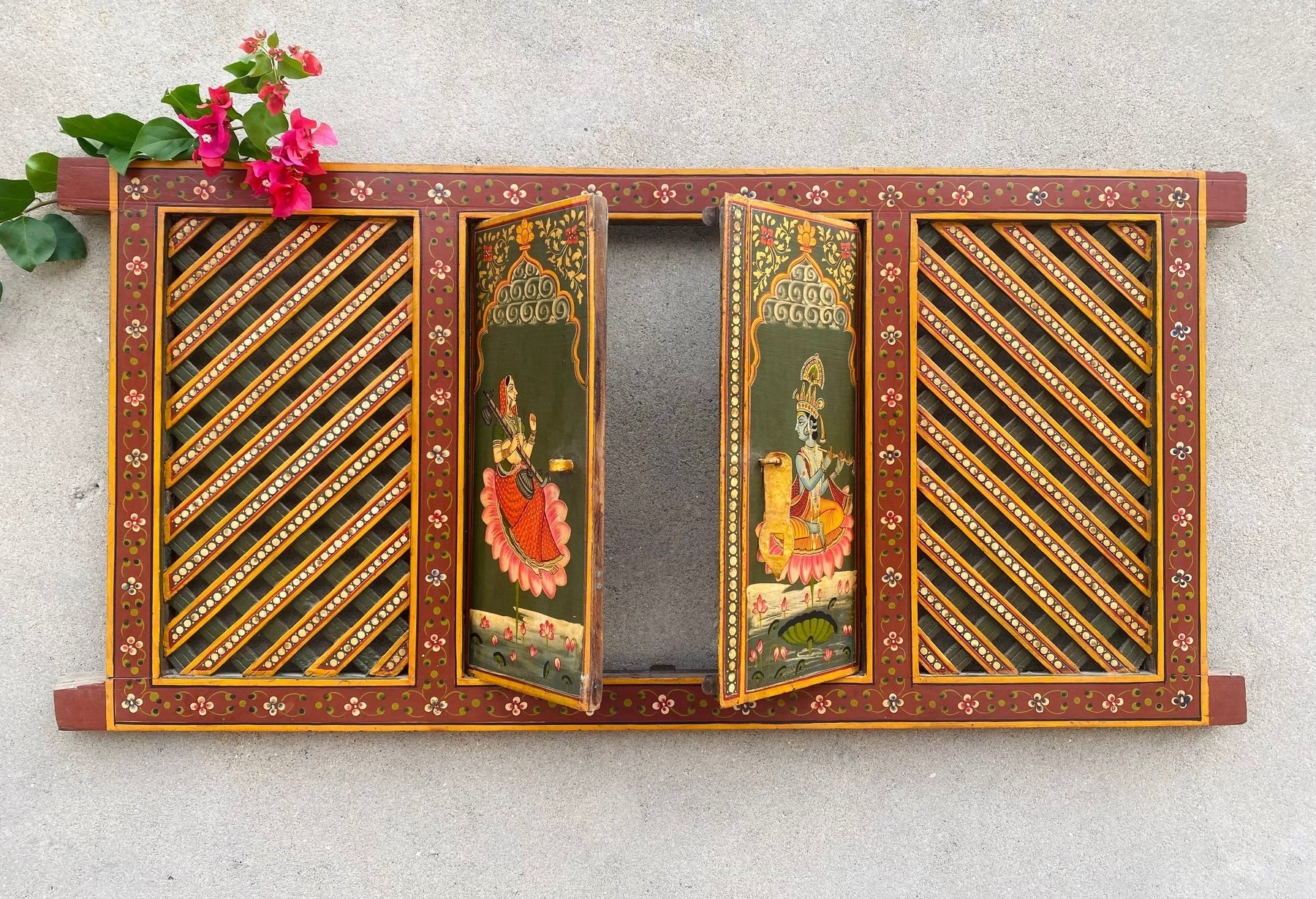 Hand-painted wooden temple window panel with traditional Indian devotional artwork and lattice doors, red and green finish, solid wood wall decor 19x40 inches Traditional hand-painted wooden jharokha style temple panel with opening doors, Indian folk art wall decor 19x40 inches Handcrafted wooden temple window frame with painted deity artwork and lattice panels, Indian wall decor solid wood Indian hand-painted wooden mandir window panel with traditional motifs and hinged doors, Decorative wooden temple pane
