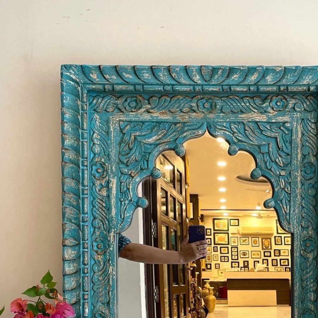 rectugular antique mirror set in a jharokha mirror frame with wood detailing, offering a blend of vintage charm and modern elegance