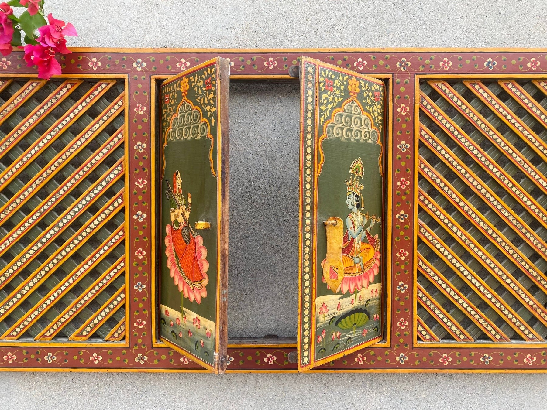 Hand-painted wooden temple window panel with traditional Indian devotional artwork and lattice doors, red and green finish, solid wood wall decor 19x40 inches Traditional hand-painted wooden jharokha style temple panel with opening doors, Indian folk art wall decor 19x40 inches Handcrafted wooden temple window frame with painted deity artwork and lattice panels, Indian wall decor solid wood Indian hand-painted wooden mandir window panel with traditional motifs and hinged doors, Decorative wooden temple pane