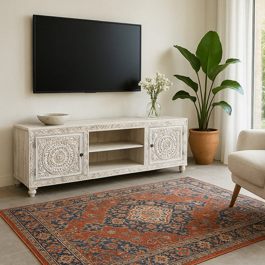 Decorative TV stand with a plant and vase in a living room setting