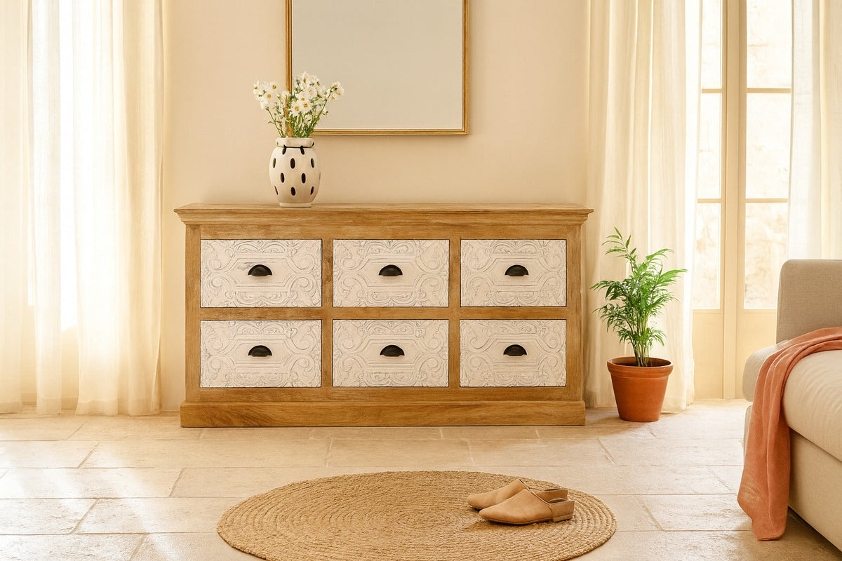 Wooden dresser with six drawers in a room with a plant and rug.