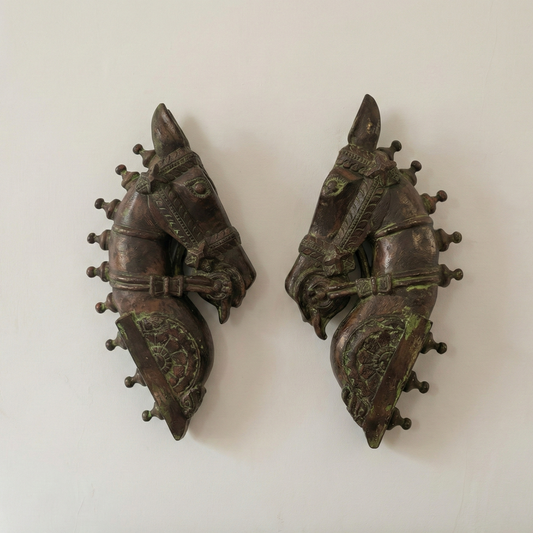 Pair of horse head sculptures, hand-carved with intricate detailing, showcasing traditional Indian craftsmanship in rustic wall art. wall decor,
wall art,
wall accents,
large wall art,
big wall decor,
outdoor wall art,
wall hanging,
vintage wall decor,
rustic wall decor,
antique wall decor,
rustic wall art,
vintage home decor,
home decor,
antique home decor vintage wall decor antique home decor living room decor office gift vintage collection