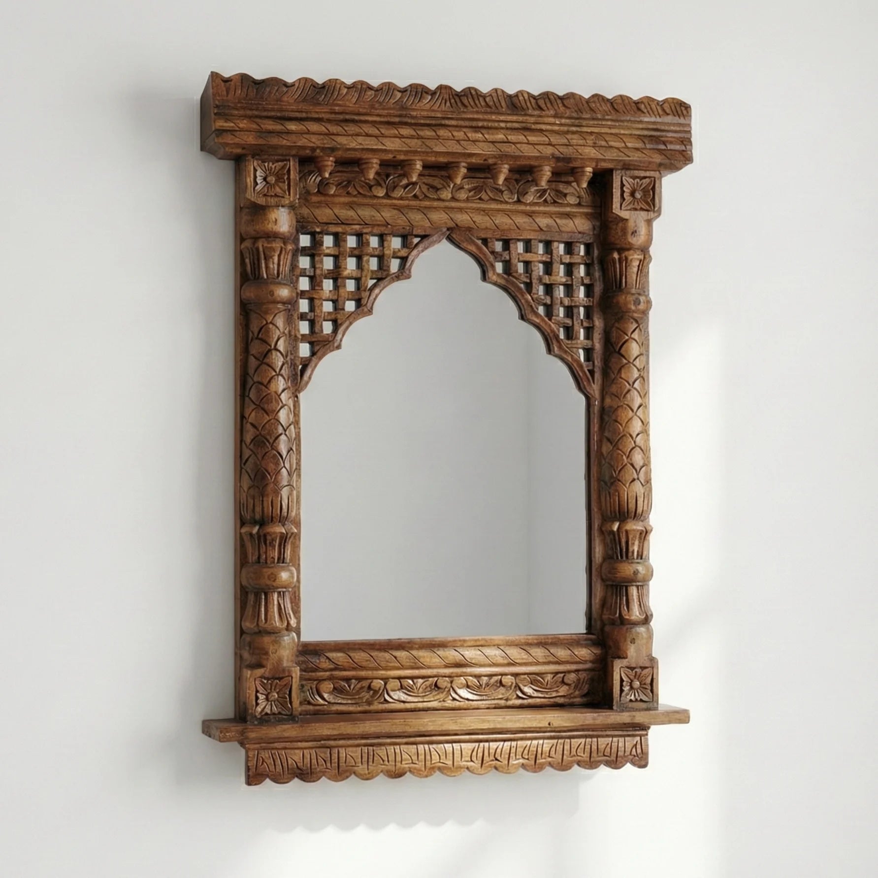 35-inch round carved wooden jharokha mirror styled on a wall