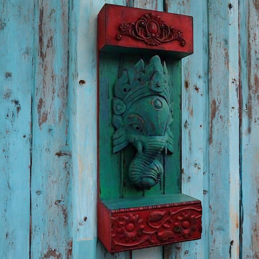 Rustic handcrafted Ganesha wall art in green and red, featuring intricate carvings and a floral base, perfect for traditional Indian home decor. wall decor,
wall art,
wall accents,
large wall art,
big wall decor,
outdoor wall art,
wall hanging,
vintage wall decor,
rustic wall decor,
antique wall decor,
rustic wall art,
vintage home decor,
home decor,
antique home decor temple wall art