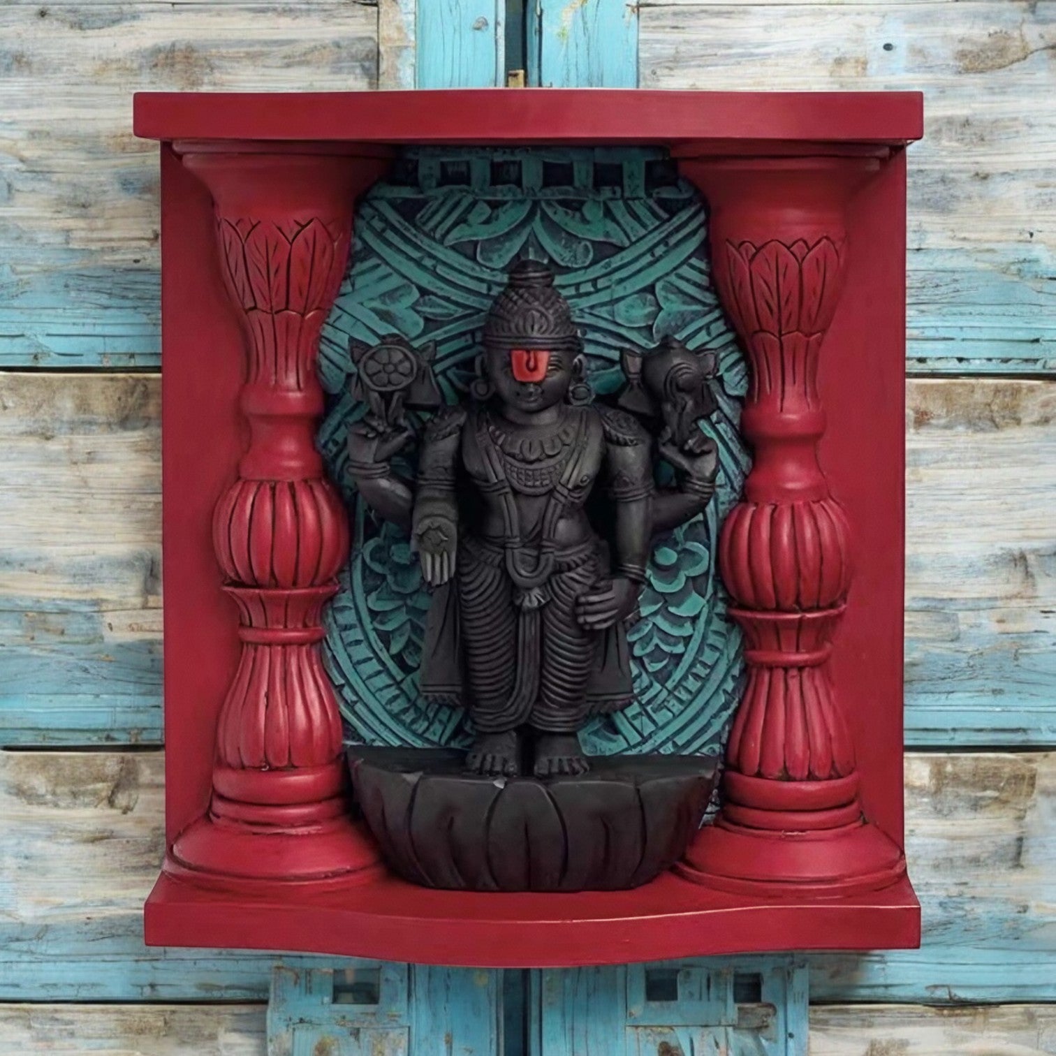 Handcrafted wooden Lord Vishnu wall art with vibrant colors, intricate carvings, and temple-inspired design, measuring 16 inches tall, 14 inches wide, and 3.5 inches deep, mounted on a decorative wooden frame with red and blue accents.