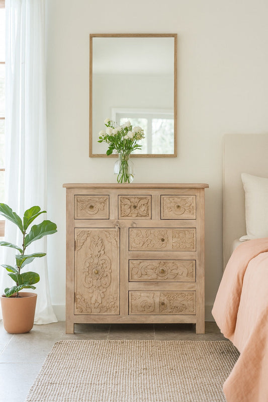 Wooden dresser with floral design in a bedroom setting