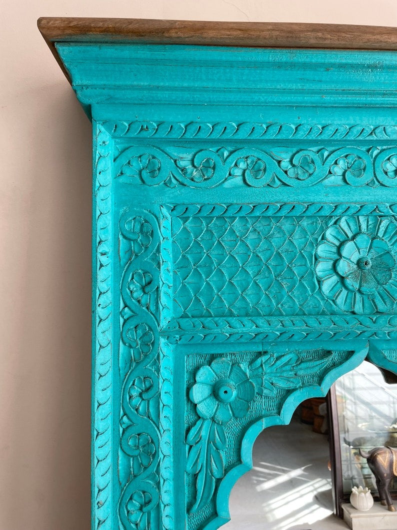 Hand-carved wooden Jharokha mirror with a bold black frame, blending vintage elegance with contemporary design for entryways or bedrooms