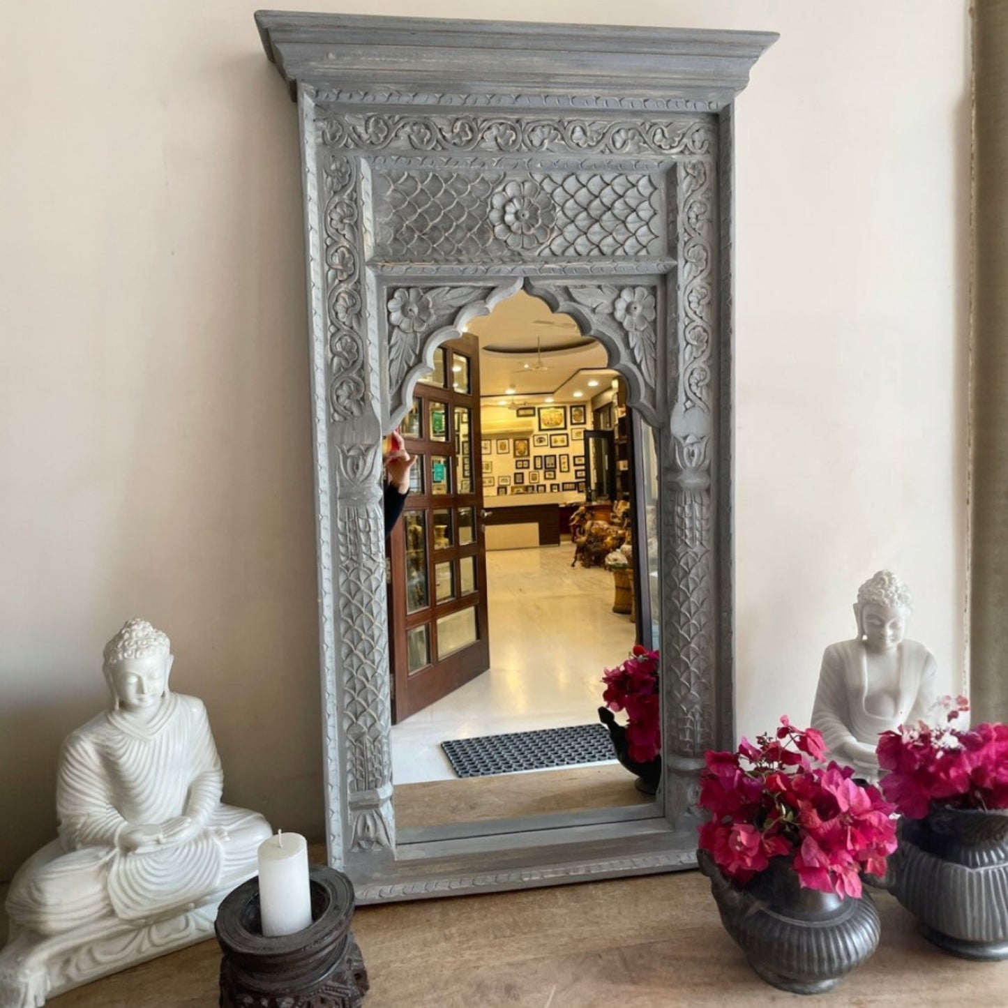 Large vintage mirror with a handcrafted Jharokha frame featuring delicate wood carvings, perfect for creating a statement in rustic or retro-style spaces.
