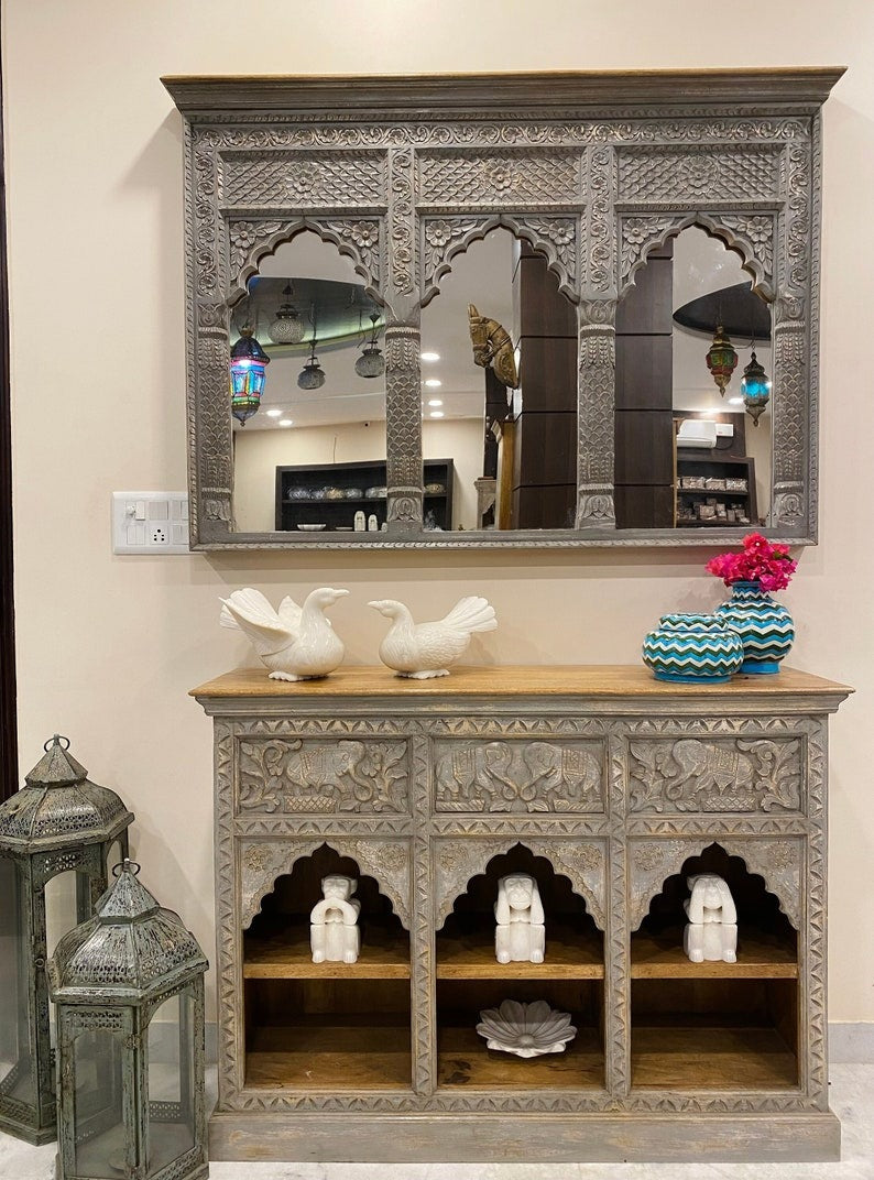 Gold-framed Jharokha mirror with delicate carvings, adding a touch of sophistication and timeless appeal to Victorian-style wall decor or vintage interiors.