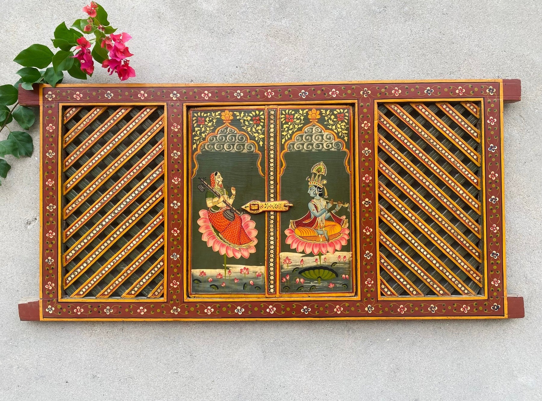 Hand-painted wooden temple window panel with traditional Indian devotional artwork and lattice doors, red and green finish, solid wood wall decor 19x40 inches Traditional hand-painted wooden jharokha style temple panel with opening doors, Indian folk art wall decor 19x40 inches Handcrafted wooden temple window frame with painted deity artwork and lattice panels, Indian wall decor solid wood Indian hand-painted wooden mandir window panel with traditional motifs and hinged doors, Decorative wooden temple pane